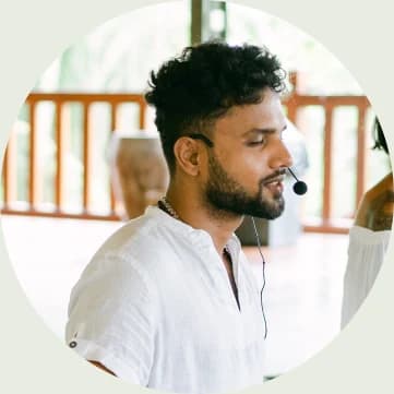 A teacher wearing a headset, guiding a class
