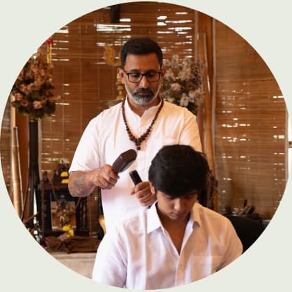 Gurudev working with a participant during a healing session